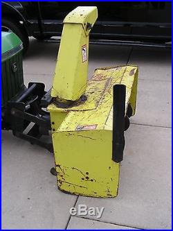 John Deere two stage 47 snow blower with 10 suitcase weights, bracket and chains